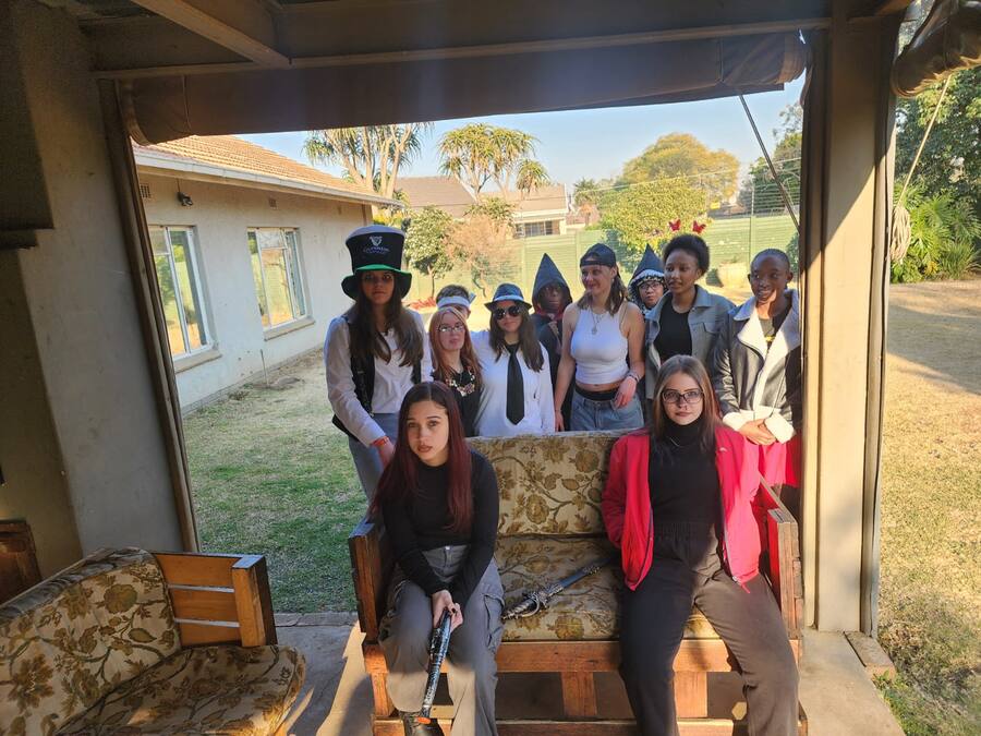Students posing on sofa during dress-up day