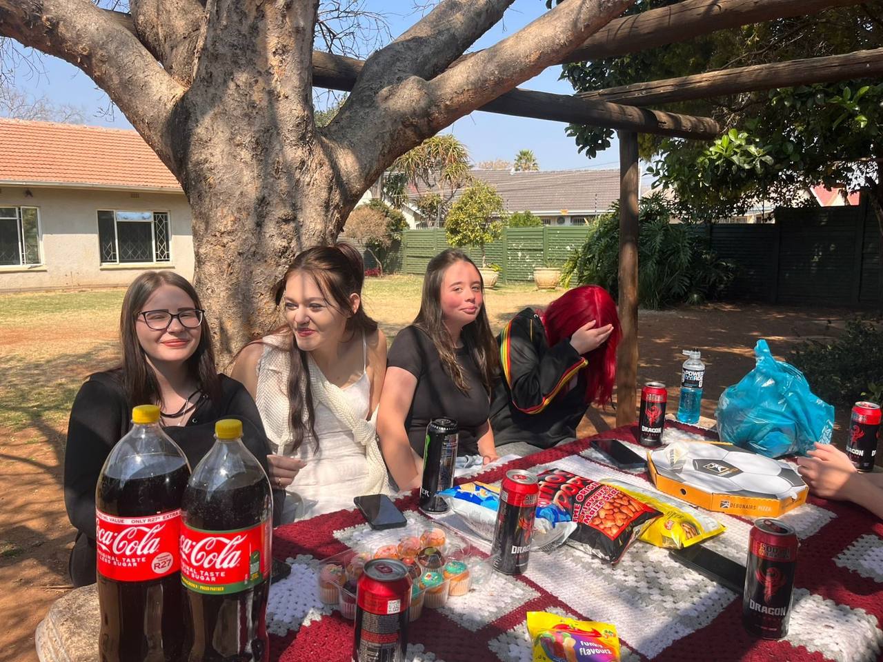 Picnic table with snacks and learners at St. Ronald's Homeschool